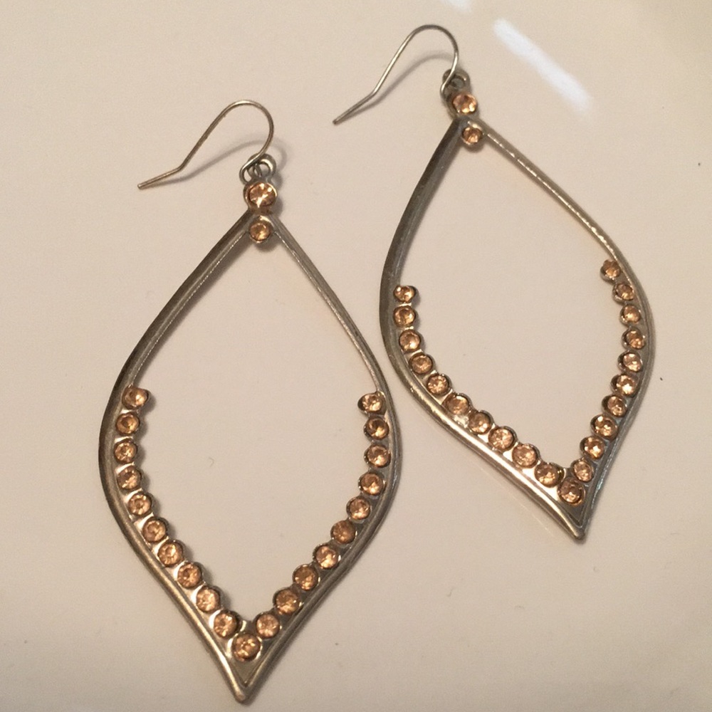 Gold dangle earrings lined with rhinestones